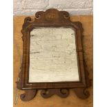 A late 18thc wall mirror with walnut and mahogany frame, shell inlay to surmount, (45cm x 32cm)