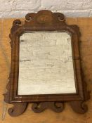 A late 18thc wall mirror with walnut and mahogany frame, shell inlay to surmount, (45cm x 32cm)