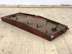 An early to mid 20th century table top football game, indistinctly stamped, 99cm x 37cm