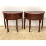 A Pair of Chinese style red lacquer and gilt chinoiserie demi lune side tables, each with a drawer