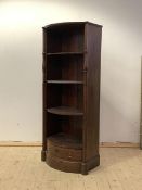 A 19th century mahogany bow front bookcase, with four open shelves over drawer, flanked by reeded