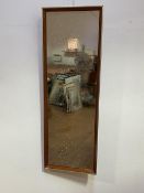 A mid century teak oblong wall mirror, (including frame 95cm x 33cm)