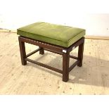 A walnut framed stool with upholstered seat, raised on square section supports, H47cm, W68cm, D41cm