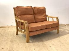 A late 20th century bamboo two seat veranda sofa with upholstered squab cushions, H89cm, W130cm,