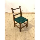 A stained fruit wood childs chair, with string seat, raised on square section supports, H57cm,