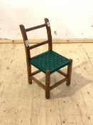 A stained fruit wood childs chair, with string seat, raised on square section supports, H57cm,
