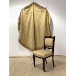 A Victorian mahogany side chair, upholstered in pale gold damask, raised on turned supports with