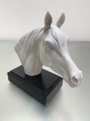 A Goebel West German porcelain moulded head of a horse mounted on ebonised stand, label verso, (h