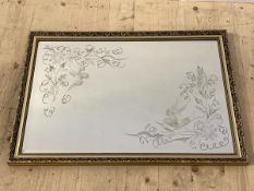 A Bevelled and etched wall hanging mirror in gilt composition frame 58cm x 84cm