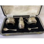 A silver condiment set, Birmingham 1966, including pepper, salt and condiment pot, two condiment