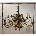 A Large gilt brass Dutch style chandelier, with ceiling rose, chain, and eighteen scrolled