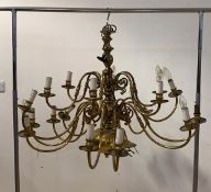 A Large gilt brass Dutch style chandelier, with ceiling rose, chain, and eighteen scrolled