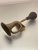 A vintage brass car horn with rubber ball end mounted on later treen plaque, (L 43 cm x d 5cm) (