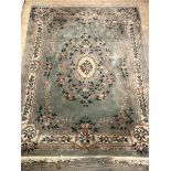 A Large Chinese super washed wool carpet, the blue field with foliate design and bordered, 380cm x