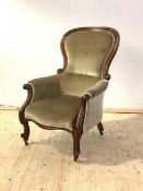 A Victorian mahogany spoon back drawing room chair, with scrolled show frame enclosing upholstered