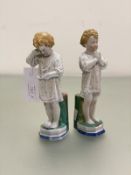An unusual pair of Victorian china figures, The Medicine and The Prayer, candle sticks with bocage