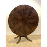 A 19th century mahogany centre or dining table, the well figured circular tilt top on four splayed
