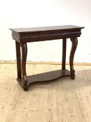 A Georgian style mahogany console table, the frieze with cushion drawer, raised on scrolled cabriole