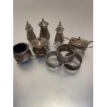 Two Birmingham silver three-piece condiment sets including drum mustard, salt and peperette and