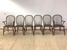 A set of six (4+2) oak Windsor chairs, with hoop and spindle back rest over saddle seats, raised