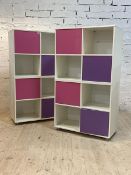 A pair of John Lewis contemporary white laminate cube shelves units, with contrasting coloured door,