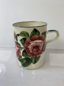 A Wemyss Ware Pottery tankard decorated with hand painted cabbage roses, stamp to base, Goode & Co