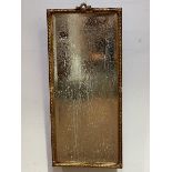 Late 19thc French gilt rectangular wall mirror with c scroll and ribbon knop with reeded border