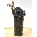 A Victorian style hammered metal umbrella stand, (H82cm) together with a collection of walking