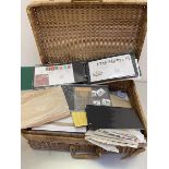 Wicker basket, 2 carrier bags and a folder containing a mix of stamps, first day covers supplies