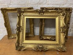 A group of three gilt composition frames, (largest internal 31cm x 41cm)