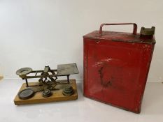 A set of shop scales and a red petrol can (h 34cm)