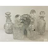 A group of four decanters, two with Bridge Crystal labels, (h 30cm), one marked Made in Edinburgh,
