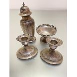 A pair of Birmingham silver Edwardian style oval desk candlesticks with weighted bases, Birmingham