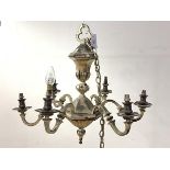 An early 20th century silvered metal Dutch style chandelier, the central section of faceted