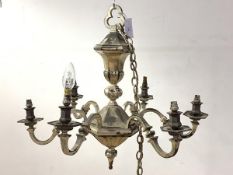 An early 20th century silvered metal Dutch style chandelier, the central section of faceted