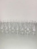 A part set of glassware including four large brandy snifters, six crystal slice cut champagne