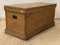 A Large 19th century pine coffer, with hinged lid, carry handle to each end, on a skirted base,
