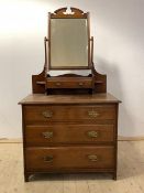 An Edwardian walnut dressing chest, with swing mirror over a trinket drawer and three graduated long