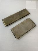 A silver double stack cigarette case, Birmingham 1935, (17cm x 5cm) and another silver cigarette