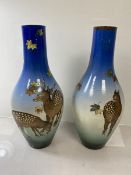 An unusual pair of Satsuma vases circa 1900 - 1920 or slender baluster form boldly painted with sika