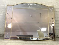 A large modern gilt framed over mantel mirror, with sectional etched and bevelled mirror panels,