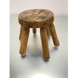 A pine treen circular stool with circular top raised on six splayed turned supports, (h 24cm, top