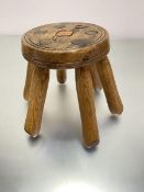 A pine treen circular stool with circular top raised on six splayed turned supports, (h 24cm, top