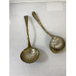 A pair of 19thc London silver ladles, markings rubbed, with initial B to handle and shell style