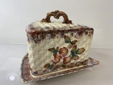 A Victorian pottery cheese dish and cover of triangular form with floral decoration (20cm x 26cm x