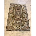 A Turkish Hand Knotted brown ground rug, 193cm x 118cm