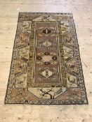 A Turkish Hand Knotted brown ground rug, 193cm x 118cm