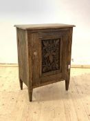 A pine cupboard, the moulded top over floral carved panelled door enclosing a shelf, raised on