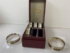 A set of six silver napkin rings, London 1902, in original box, combined weight 31 grammes