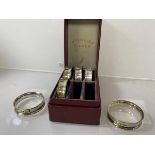 A set of six silver napkin rings, London 1902, in original box, combined weight 31 grammes